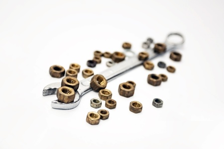 The nut wrench with nuts on a white backgroundの写真素材