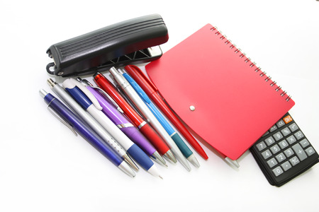Set of office tools - handles, a notebook, a stapler, the calculator