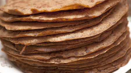 Brown pancakes from beef livers are put at each other