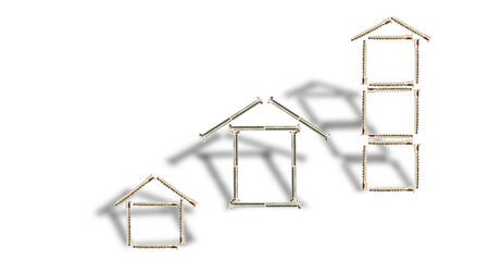 Design of three houses from bolts on a white backgroundの写真素材