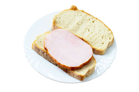 Bread with juicy boiled pork on a ceramic plate on a white backgroundの写真素材