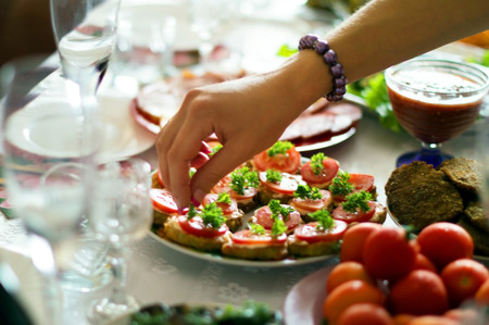 Process of table layout and decoration of dishes on a holiday tableの写真素材