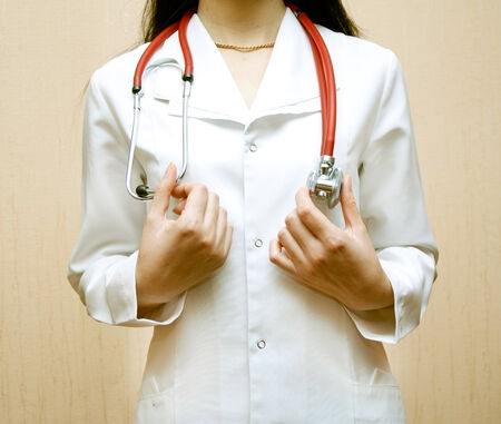 The doctor in a white dressing gown with a stethoscope