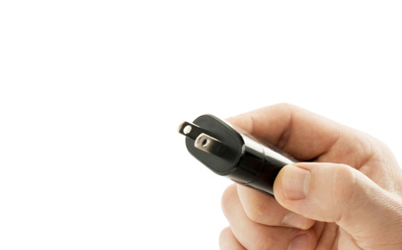 Plug the male hand for electric power on a white 
