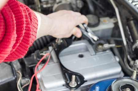 The process of connecting the charger to the the vehicle battery for charging