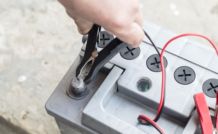 The process of connecting the charger to the the vehicle battery for chargingの写真素材