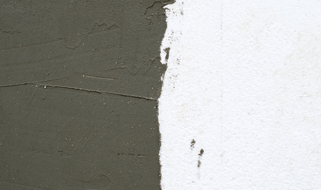 Textures, facade work - on the wall of foam plastic applied plasteringの写真素材