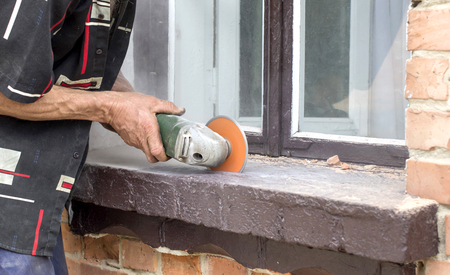 The process of cutting concrete and bricks using grindersの写真素材