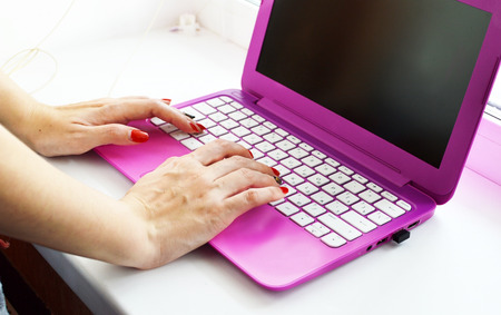 The process of pressing buttons on the laptop keyboardの写真素材