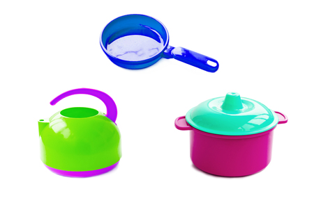 Children's plastic tea maker, pans and pan on a white backgroundの写真素材