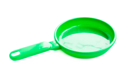 Children's plastic pans on a white backgroundの写真素材