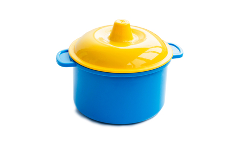 Children's plastic pan on a white backgroundの写真素材