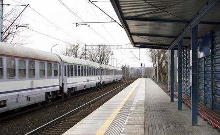 The train of wagons at a railway station in the open air