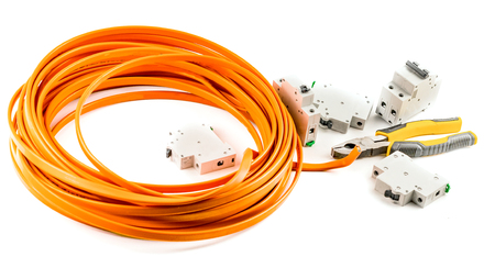 Electric cable yellow, pliers and automatic switches on a white backgroundの写真素材