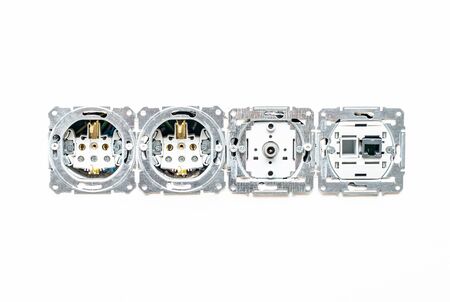 Internal sockets for power, internet and television without frame on white plaster wall background