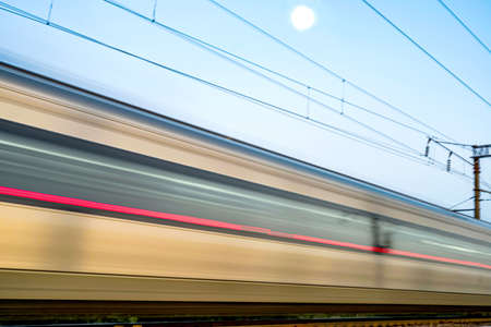 Blurred train car at high speed in the eveningの写真素材