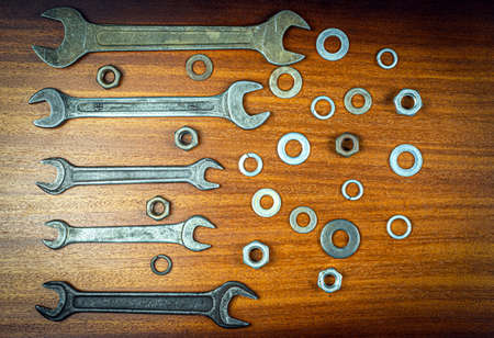 Knolling style photo - various items and tools for home repair on a background of brown wood textureの写真素材
