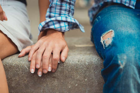 A young couple in love touched hands on the first dateの写真素材