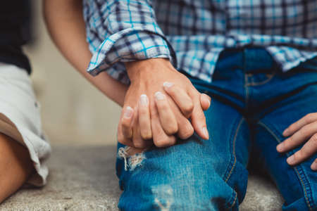 A young couple in love touched hands on the first dateの写真素材