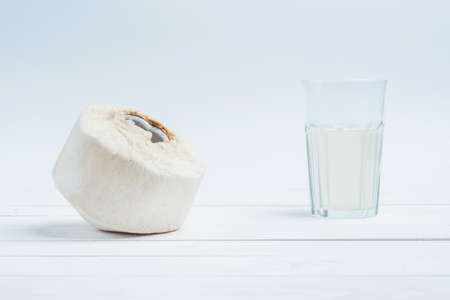 Coconut with a glass of fresh coconut water.の写真素材