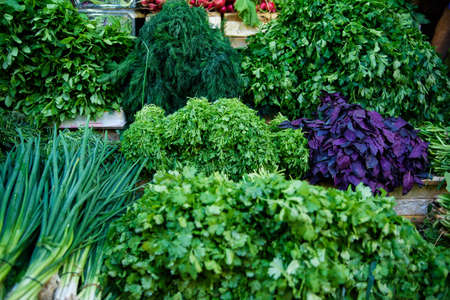 Fresh green vegetables on outdoor market. Healthy foodの写真素材