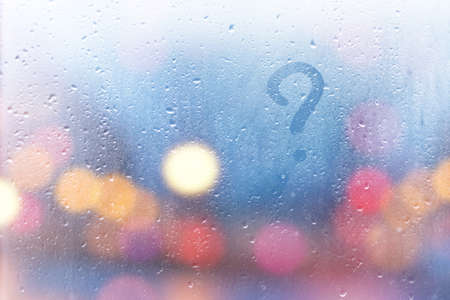 the inscription on the sweaty glass question mark.の写真素材