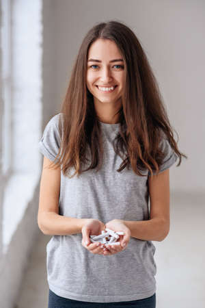 Female hands holding broken cigarettes. Concept of health protection. Quit smoking, health care concept. No smoking.の写真素材