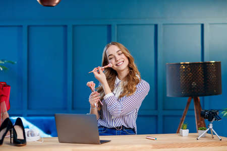 Young attractive woman recording video about make up.の写真素材