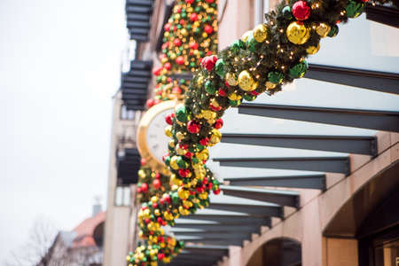 Christmas wreaths, balls and other decorations on the street.