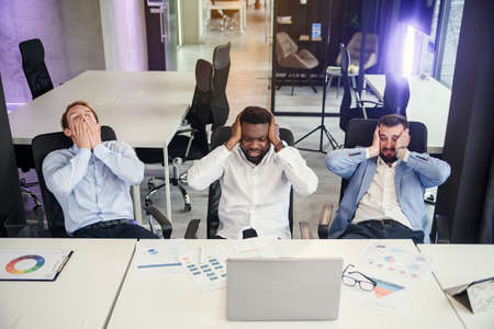 Frustrated businessmen have failed on the stock exchange or financial market. Economic problems of a young company, collapse and failure.の写真素材