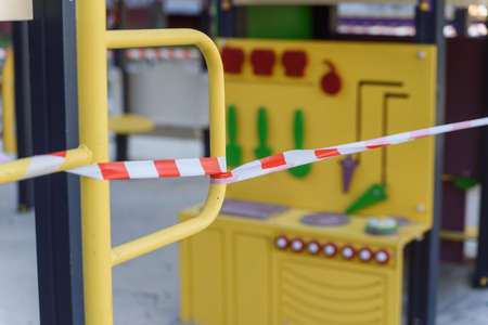 Coronavirus COVID-19 restriction. No people due to quarantine. Closed childrens playground in the...