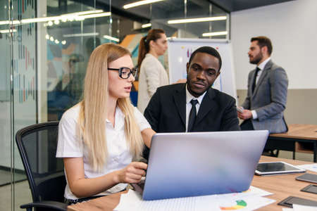 Creating a future development strategy for young progressive company. Pleasant high-skilled business...