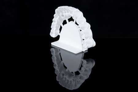 Milled raw zircon dental prosthesis for patient after milling machine, lower jaw.