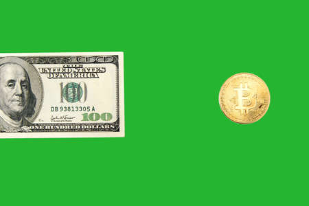 One hundred dollar bill and bitcoin on a white background isolated. Cryptocurrency business concept....