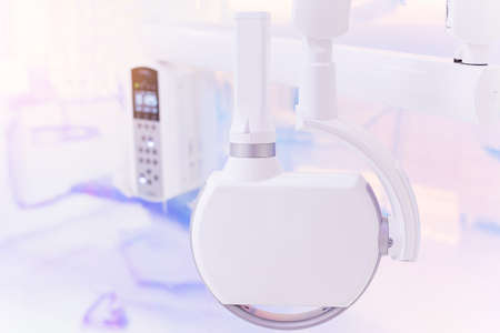 Portable intraoral x-ray machine at modern dental clinic. Healthcare and dental treatment concept.の写真素材