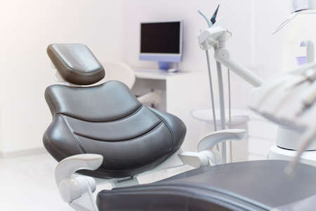 Modern Dental Clinic. Comfortable dentist chair. Dental equipment and accessories.の写真素材