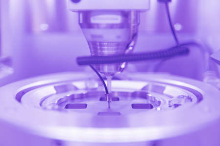 Cad cam milling machine in dental laboratory. Production of high esthetic dental crowns and dentures.の写真素材