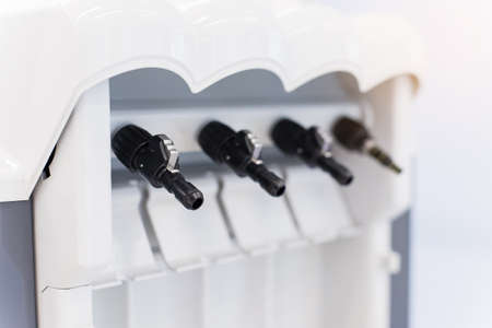 Dental handpieces cleans and lubricates on a special machine. Professional equipment care.の写真素材