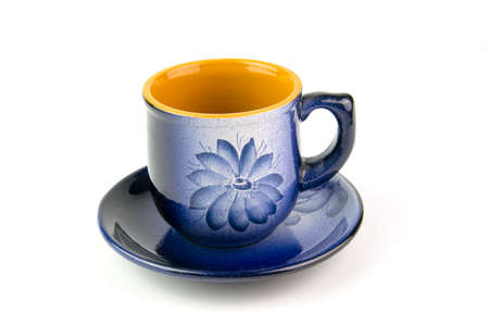 Beautiful blue cup with a pattern on a white background
