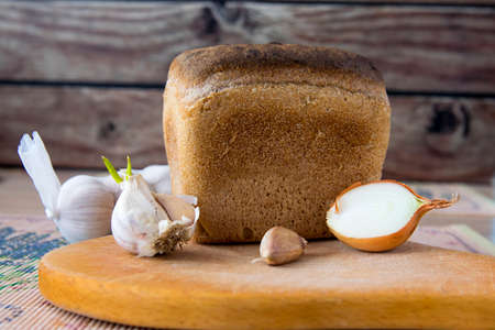 Garlic, onion  bread on the tableの写真素材