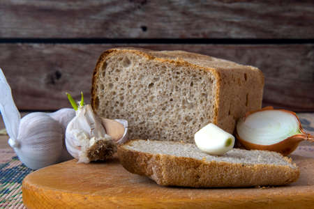 Garlic, onion  bread on the tableの写真素材