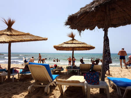 Hammamet, Tunisia - July 25, 2017: People relax on the beach of hotel Club Novostar Sol Azur Beach Congres.のeditorial素材