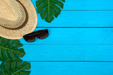 Summer holiday background. Top view of beach summer accessories with copy space. Flat lay, top viewの写真素材