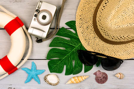 Traveler accessories with empty space for text. Travel vacation concept. Summer background. Beach fashion , summer concept. Road frame set. Flat lay, top viewの写真素材