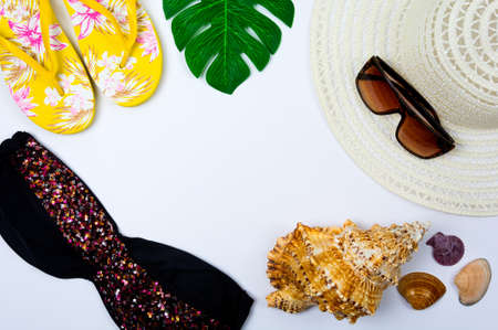 Traveler accessories on white background with empty space for text. Travel vacation concept. Summer background. Road frame set. Flat lay, top viewの写真素材