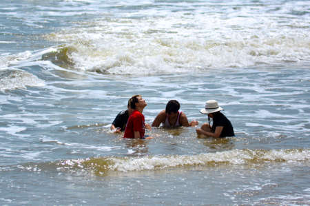 Vung Tau, Vietnam - January 26, 2018: Local residents bathe in the sea in clothesのeditorial素材