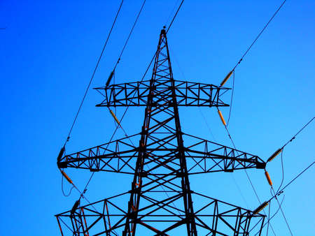Silhouette High voltage electric tower on sunset time and sky on sunset time background.