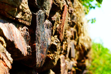 Ancient wall made of large stones of iron ore bonded by sand.の写真素材