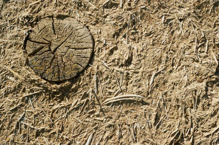 Old wall of a combination of red clay and straw, backgroundの写真素材
