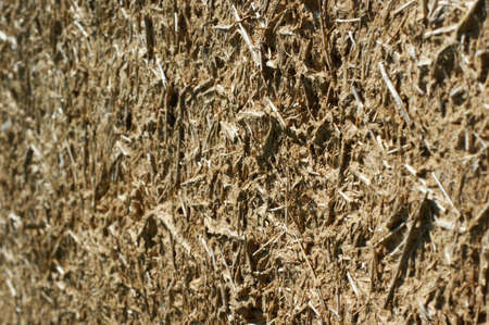 Old wall of a combination of red clay and straw, background